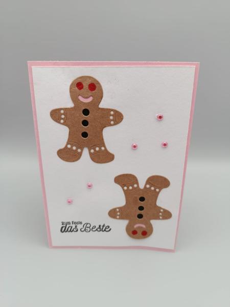 Festliche Grußkarte mit Lebkuchenpaar und Rosa Akzenten